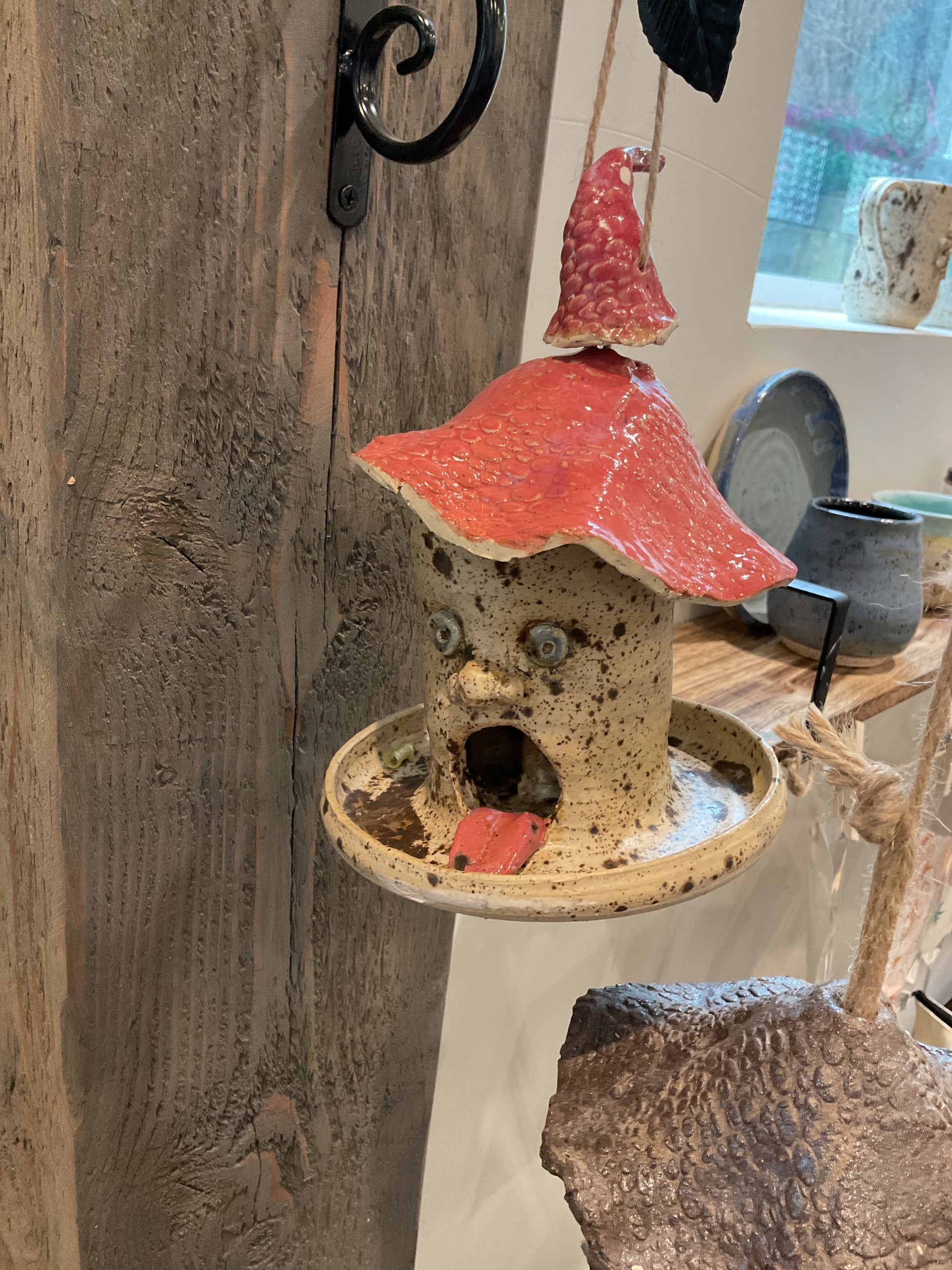 Pottery- face birdfeeder