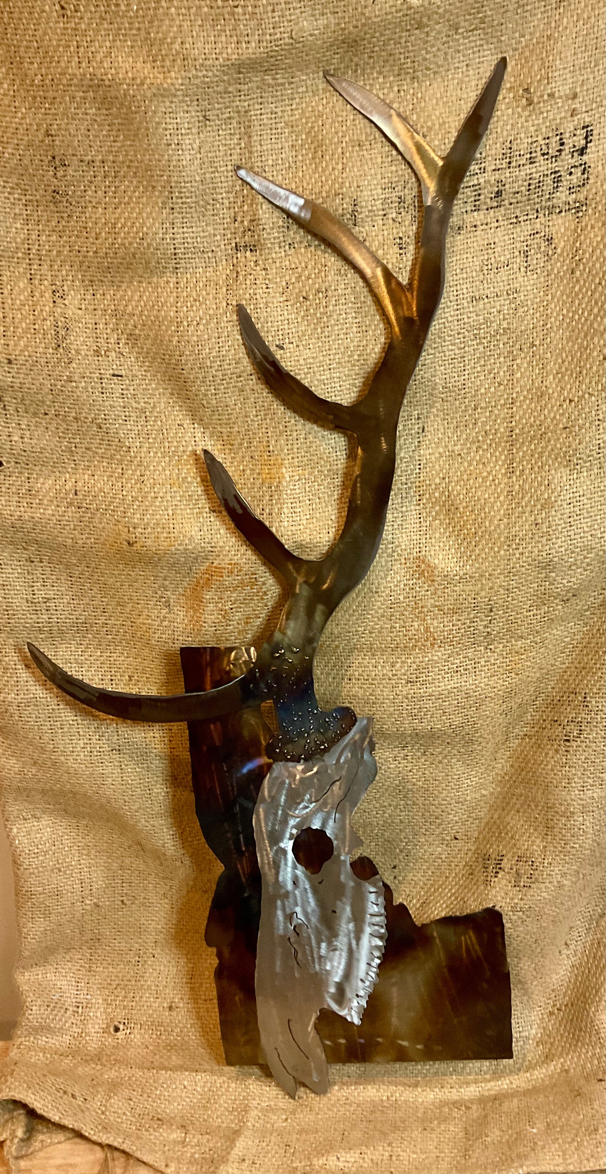 Metal elk skull over Idaho