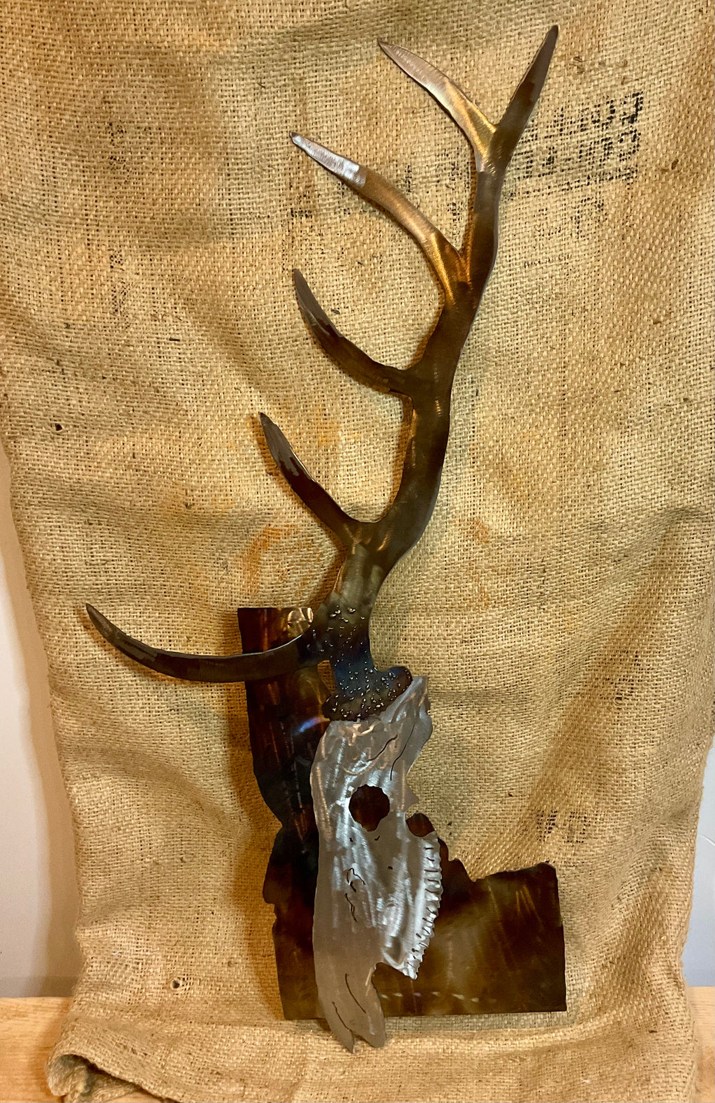 Metal elk skull over Idaho