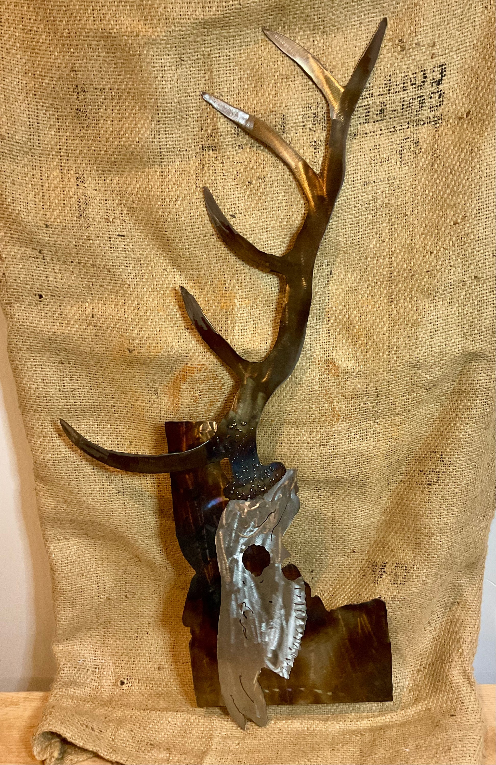 Metal elk skull over Idaho
